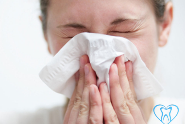 Girl blowing her nose